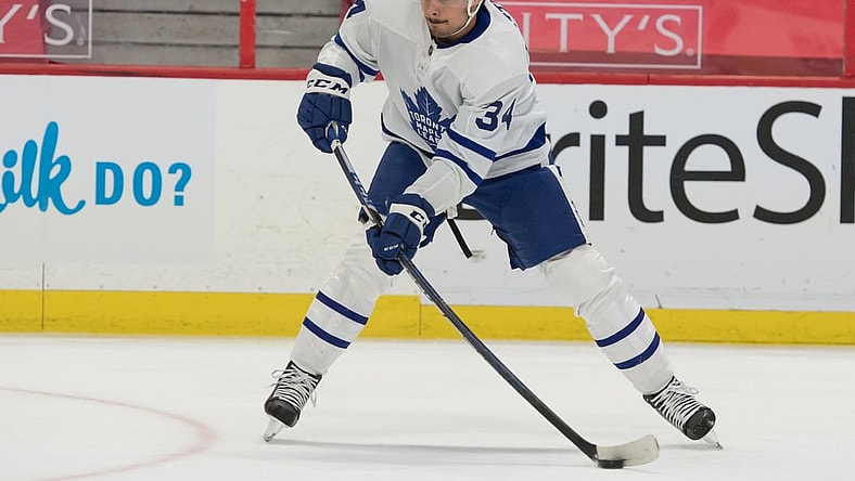 May 12, 2021; Ottawa, Ontario, CAN; Toronto Maple Leafs center Auston Mathews (34) controls the puck in the first period against the Ottawa Senators at the Canadian Tire Centre. Mandatory Credit: Marc DesRosiers-USA TODAY Sports