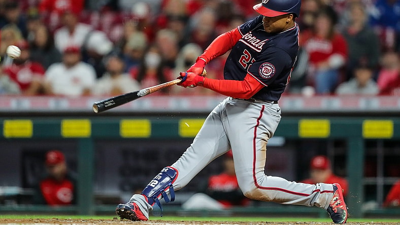 Sep 25, 2021; Cincinnati, Ohio, USA; Washington Nationals right fielder Juan Soto (22) hits a single against the Cincinnati Reds in the fourth inning at Great American Ball Park. Mandatory Credit: Katie Stratman-USA TODAY Sports