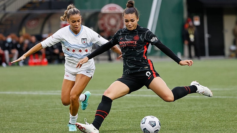 Nov 14, 2021; Portland, OR, USA; Portland Thorns forward Sophia Smith (9) attempts to score as Chicago Red Stars  defender Sarah Gorden (11 defends during the second half of the NWSL semi final at Providence Park. Mandatory Credit: Soobum Im-USA TODAY Sports