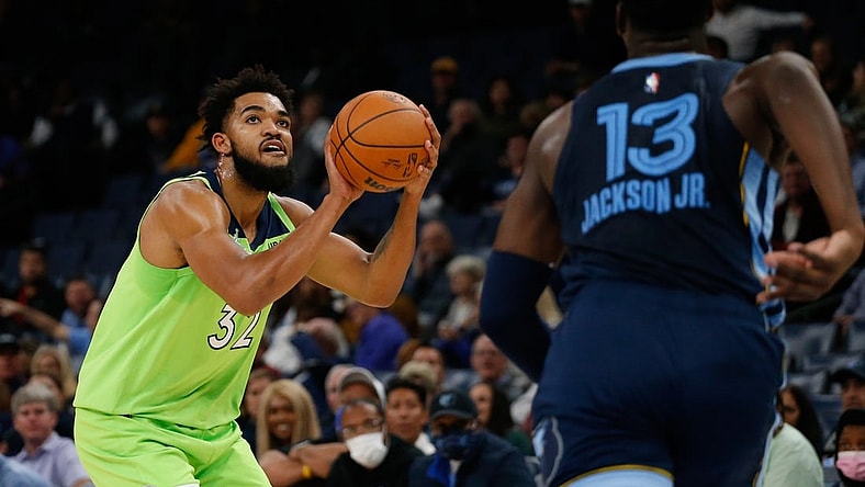 Nov 8, 2021; Memphis, Tennessee, USA; Minnesota Timberwolves center/forward Karl-Anthony Towns (32) shoots for three during the first half against the Memphis Grizzles at FedExForum. Mandatory Credit: Petre Thomas-USA TODAY Sports