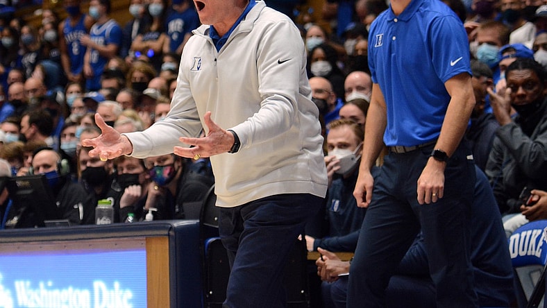 Nov 22, 2021; Durham, North Carolina, USA;  Duke Blue Devils head coach Mike Krzyzewski (left) and associate head coach Jon Scheyer react during the first half against Duke Blue Devils at Cameron Indoor Stadium. Mandatory Credit: Rob Kinnan-USA TODAY Sports