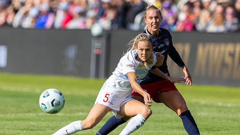 Nov 20, 2021; Louisville, Kentucky, USA; Chicago Red Stars forward Rachel Hill (5) passes the ball against Washington Spirit midfielder Julia Roddar (16) during the NWSL Championship match against the Chicago Red Stars at Lynn Family Stadium. Mandatory Credit: Jordan Prather-USA TODAY Sports
