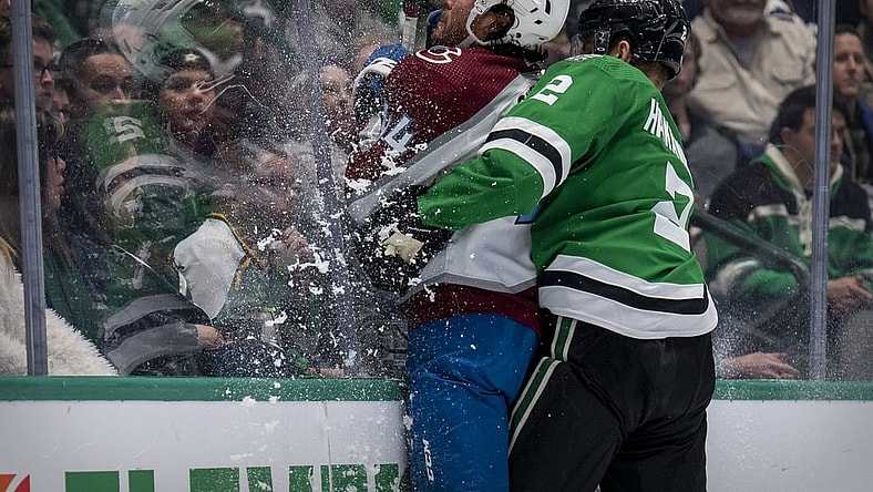 Nov 26, 2021; Dallas, Texas, USA; Dallas Stars defenseman Jani Hakanpaa (2) checks Colorado Avalanche left wing Kiefer Sherwood (44) during the third period at the American Airlines Center. Mandatory Credit: Jerome Miron-USA TODAY Sports