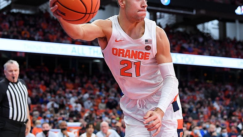 Nov 30, 2021; Syracuse, New York, USA; Syracuse Orange forward Cole Swider (21) saves a loose ball from going out of bounds against the Indiana Hoosiers during the first half at the Carrier Dome. Mandatory Credit: Rich Barnes-USA TODAY Sports