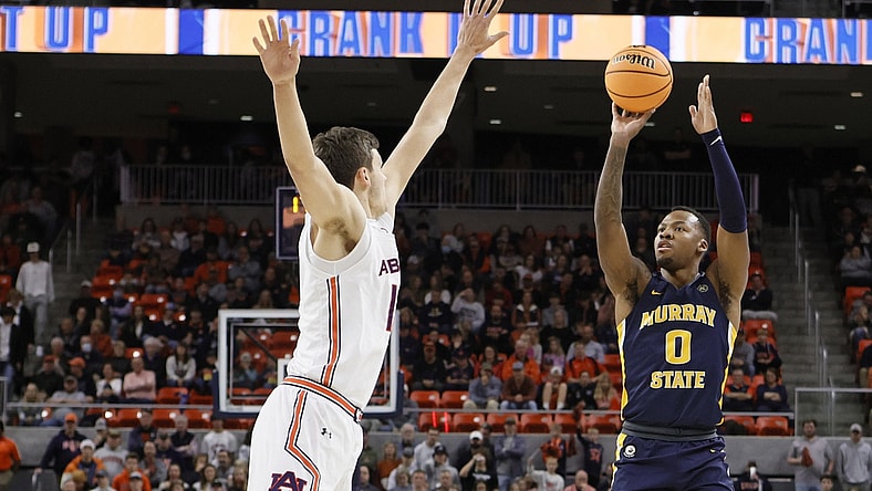 Dec 22, 2021; Auburn, Alabama, USA; Murray State Racers forward KJ Williams (0) shoots over Auburn Tigers forward Jabari Smith (10) during the first half at Auburn Arena. Mandatory Credit: John Reed-USA TODAY Sports
