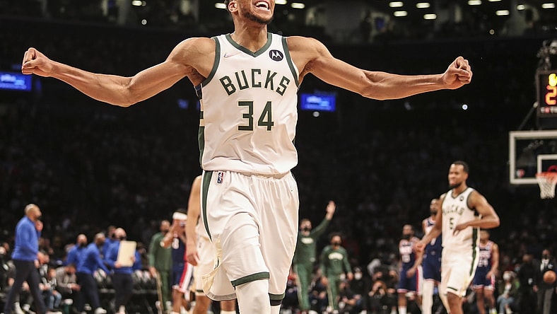 Jan 7, 2022; Brooklyn, New York, USA;  Milwaukee Bucks forward Giannis Antetokounmpo (34) celebrates after the Brooklyn Nets call a time out in the fourth quarter at Barclays Center. Mandatory Credit: Wendell Cruz-USA TODAY Sports