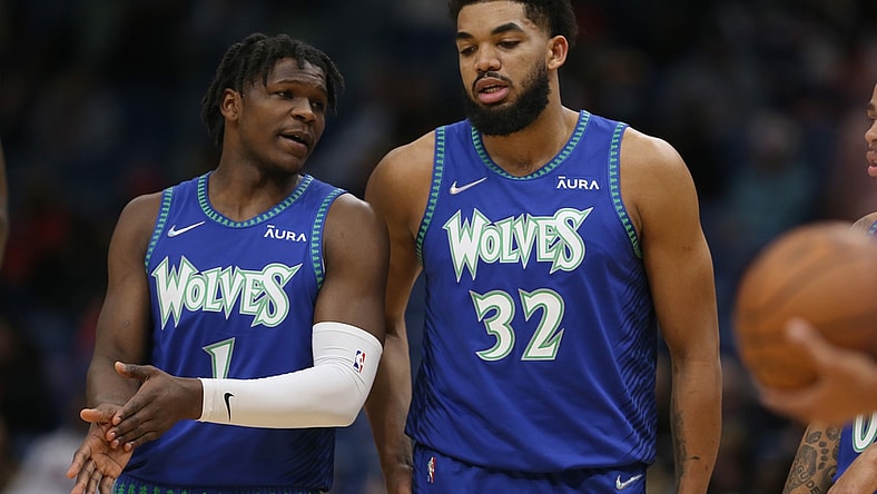 Jan 11, 2022; New Orleans, Louisiana, USA; Minnesota Timberwolves forward Anthony Edwards (1) talks to center Karl-Anthony Towns (32) in the first quarter against the New Orleans Pelicans at the Smoothie King Center. Mandatory Credit: Chuck Cook-USA TODAY Sports