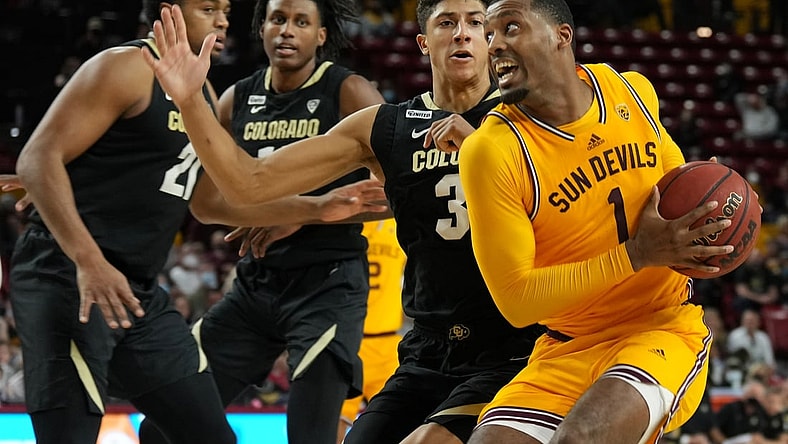 Jan 15, 2022; Tempe, Arizona, USA; Colorado Buffaloes guard Nique Clifford (32) guards Arizona State Sun Devils guard Luther Muhammad (1) during the second half at Desert Financial Arena. Mandatory Credit: Joe Camporeale-USA TODAY Sports