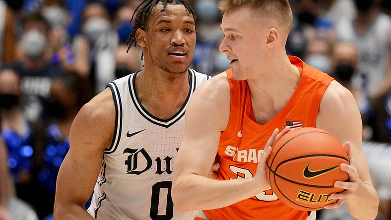 Jan 22, 2022; Durham, North Carolina, USA; Syracuse Orange guard Buddy Boeheim (35) controls the ball in front of Duke Blue Devils forward Wendell Moore Jr. (0) during the second half at Cameron Indoor Stadium. Mandatory Credit: Rob Kinnan-USA TODAY Sports
