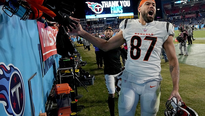 Jan 22, 2022; Nashville, Tennessee, USA; Cincinnati Bengals tight end C.J. Uzomah (87) celebrates after the Bengals defeated the Tennessee Titans 19-16 during the AFC Divisional playoff football game at Nissan Stadium. Mandatory Credit: Kirby Lee-USA TODAY Sports