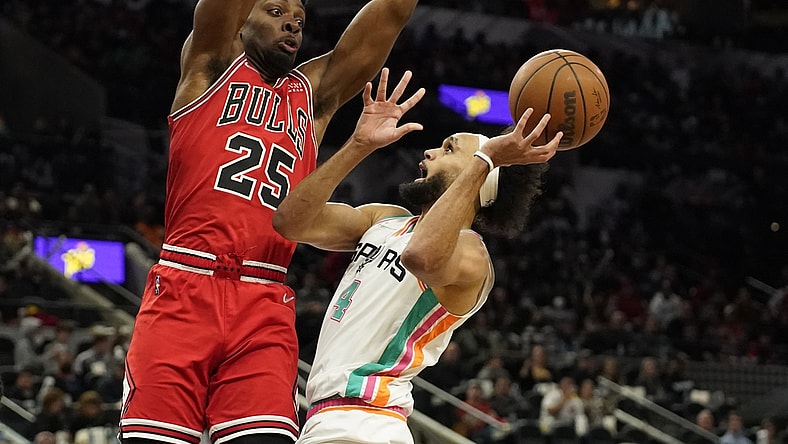 Jan 28, 2022; San Antonio, Texas, USA; San Antonio Spurs guard Derrick White (4) shoots over Chicago Bulls forward Tyler Cook (25) during the second half at ATT Center. Mandatory Credit: Scott Wachter-USA TODAY Sports
