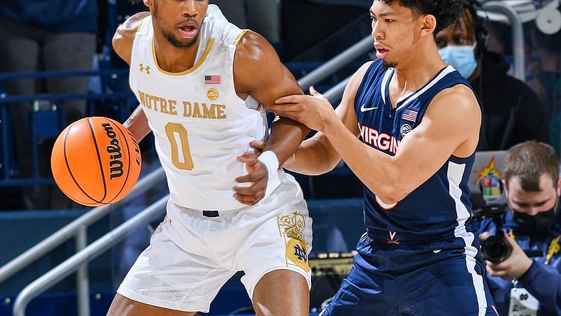 Jan 29, 2022; South Bend, Indiana, USA; Notre Dame Fighting Irish guard Blake Wesley (0) dribbles as Virginia Cavaliers guard Kihei Clark (0) defends in the first half at the Purcell Pavilion. Mandatory Credit: Matt Cashore-USA TODAY Sports