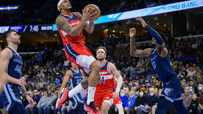 Jan 29, 2022; Memphis, Tennessee, USA; Washington Wizards guard Bradley Beal (3) drives to the basket past m48 and forward Jaren Jackson Jr. (13) during the second quarter at the FedExForum. Mandatory Credit: Jerome Miron-USA TODAY Sports