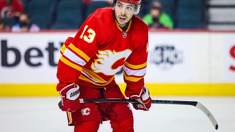Jan 29, 2022; Calgary, Alberta, CAN; Calgary Flames left wing Johnny Gaudreau (13) during the face off against the Vancouver Canucks during the third period at Scotiabank Saddledome. Mandatory Credit: Sergei Belski-USA TODAY Sports
