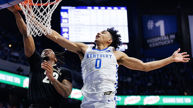 Feb 2, 2022; Lexington, Kentucky, USA; Kentucky Wildcats forward Jacob Toppin (0) blocks a shot by Vanderbilt Commodores guard Jamaine Mann (23) during the first half at Rupp Arena at Central Bank Center. Mandatory Credit: Jordan Prather-USA TODAY Sports