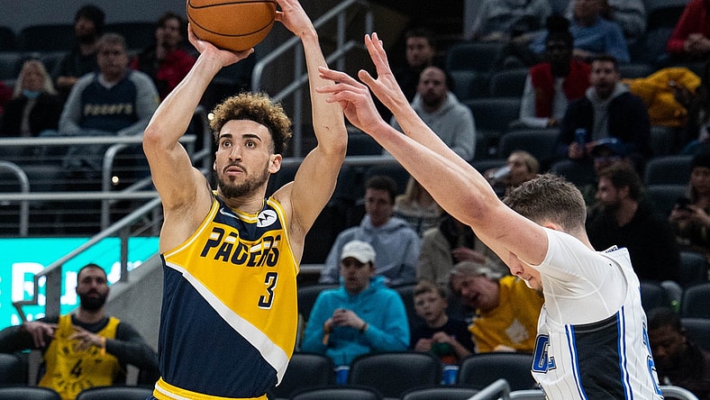 Feb 2, 2022; Indianapolis, Indiana, USA; Indiana Pacers guard Chris Duarte (3) shoots the ball while Orlando Magic center Moritz Wagner (21) defends in the first half at Gainbridge Fieldhouse. Mandatory Credit: Trevor Ruszkowski-USA TODAY Sports