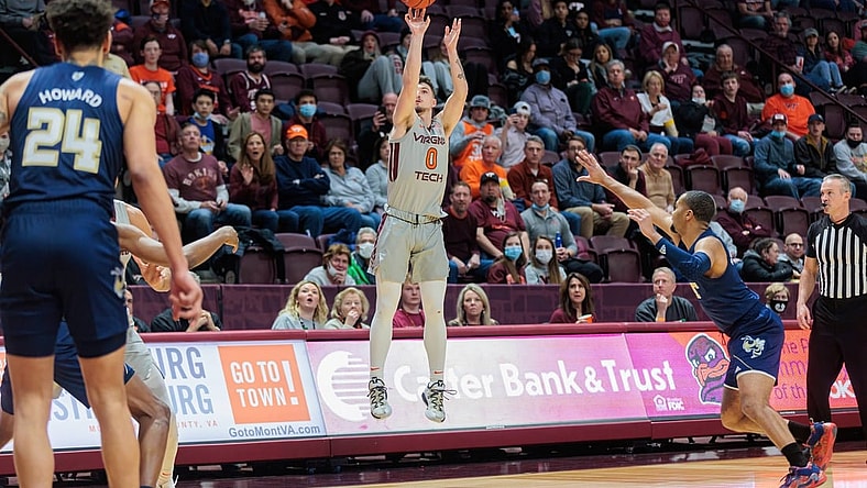 Feb 2, 2022; Blacksburg, Virginia, USA; Virginia Tech Hokies guard Hunter Cattoor (0) shoots against the Georgia Tech Yellow Jackets during the first half at Cassell Coliseum. Mandatory Credit: Ryan Hunt-USA TODAY Sports