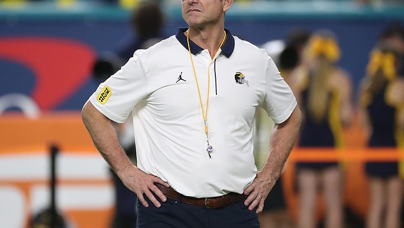 Michigan coach Jim Harbaugh watched his team warm up before the Orange Bowl against Georgia on Friday, Dec. 31, 2021, in Miami Gardens, Florida.Capital One Orange Bowl