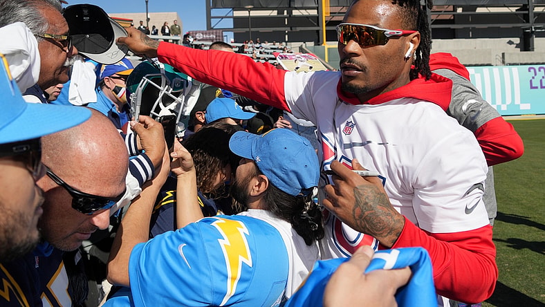 Feb 5, 2022; Las Vegas, NV, USA; Los Angeles Chargers safety Derwin James signs autographs during AFC practice at the Las Vegas Ballpark. Mandatory Credit: Kirby Lee-USA TODAY Sports