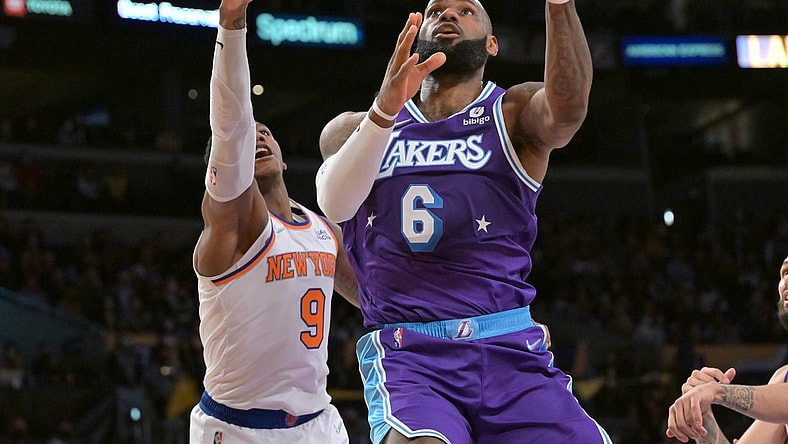 Feb 5, 2022; Los Angeles, California, USA;   Los Angeles Lakers forward LeBron James (6) goes up for a basket past New York Knicks guard RJ Barrett (9) in the second half at Crypto.com Arena. Mandatory Credit: Jayne Kamin-Oncea-USA TODAY Sports