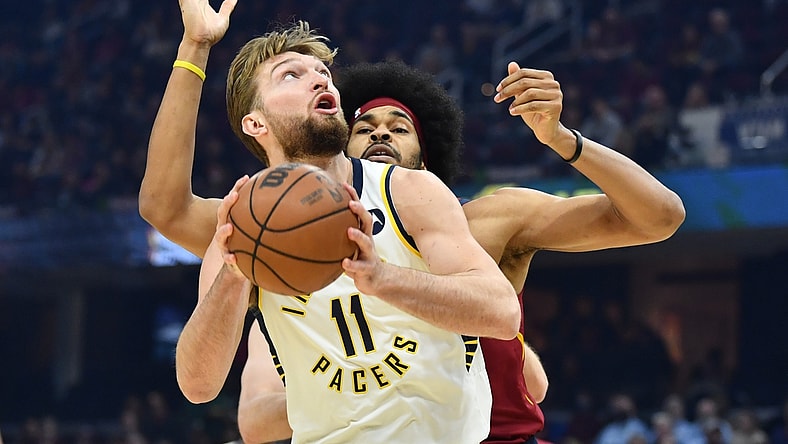 Feb 6, 2022; Cleveland, Ohio, USA; Indiana Pacers forward Domantas Sabonis (11) drives to the basket against Cleveland Cavaliers center Jarrett Allen (31) during the first quarter at Rocket Mortgage FieldHouse. Mandatory Credit: Ken Blaze-USA TODAY Sports