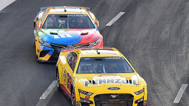Feb 6, 2022; Los Angeles, California, USA; NASCAR Series Cup driver Joey Logano (22) and Kyle Busch (18) race for position during the Busch Light Clash at The Coliseum at Los Angeles Memorial Coliseum. Mandatory Credit: Gary A. Vasquez-USA TODAY Sports