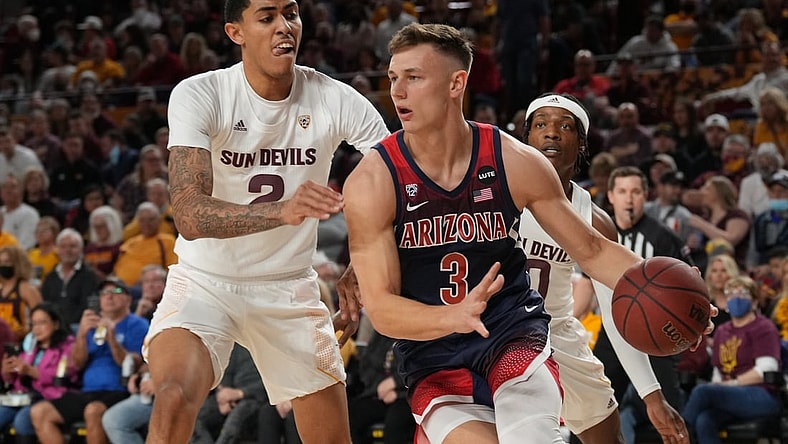 Feb 7, 2022; Tempe, Arizona, USA; Arizona Wildcats guard Pelle Larsson (3) dribbles against Arizona State Sun Devils forward Jalen Graham (2) during the first half at Desert Financial Arena. Mandatory Credit: Joe Camporeale-USA TODAY Sports