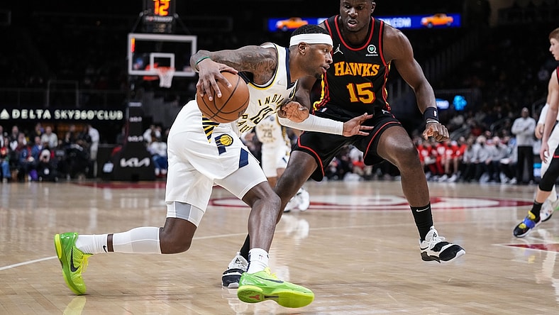 Feb 8, 2022; Atlanta, Georgia, USA; Indiana Pacers forward Torrey Craig (13) dribbles against Atlanta Hawks center Clint Capela (15) during the first half at State Farm Arena. Mandatory Credit: Dale Zanine-USA TODAY Sports
