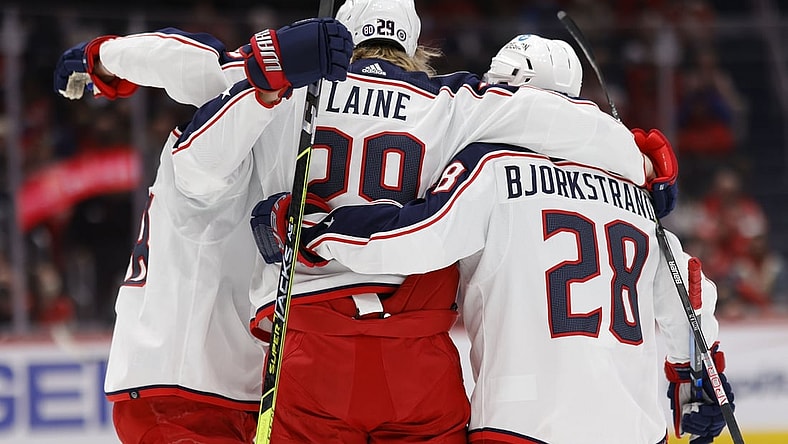 Feb 8, 2022; Washington, District of Columbia, USA; Columbus Blue Jackets left wing Patrik Laine (29) celebrates with teammates after scoring a goal against the Washington Capitals during the second period at Capital One Arena. Mandatory Credit: Geoff Burke-USA TODAY Sports