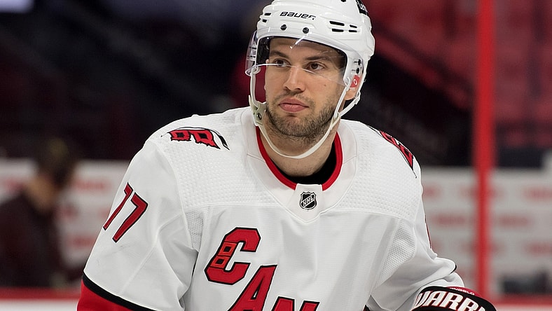Feb 8, 2022; Ottawa, Ontario, CAN; Carolina Hurricanes defenseman Tony DeAngelo (77) skates during a break in the second period against the Ottawa Senators at the Canadian Tire Centre. Mandatory Credit: Marc DesRosiers-USA TODAY Sports