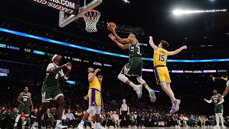Feb 8, 2022; Los Angeles, California, USA; Milwaukee Bucks forward Giannis Antetokounmpo (34) moves to the basket ahead of Los Angeles Lakers guard Austin Reaves (15) during the second half at Crypto.com Arena. Mandatory Credit: Gary A. Vasquez-USA TODAY Sports