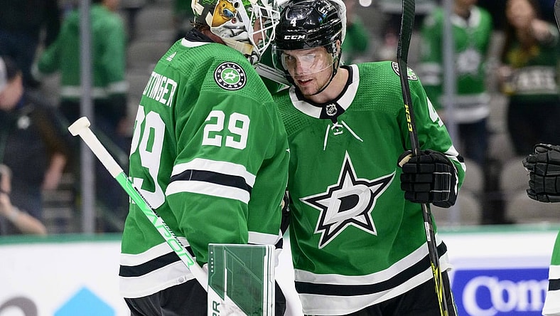 Feb 9, 2022; Dallas, Texas, USA; Dallas Stars goaltender Jake Oettinger (29) and defenseman Miro Heiskanen (4) celebrate the win over the Nashville Predators at the American Airlines Center. Mandatory Credit: Jerome Miron-USA TODAY Sports