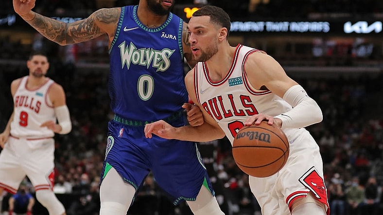 Feb 11, 2022; Chicago, Illinois, USA; Chicago Bulls guard Zach LaVine (8) drives around Minnesota Timberwolves guard D'Angelo Russell (0) during the first half at the United Center. Mandatory Credit: Dennis Wierzbicki-USA TODAY Sports