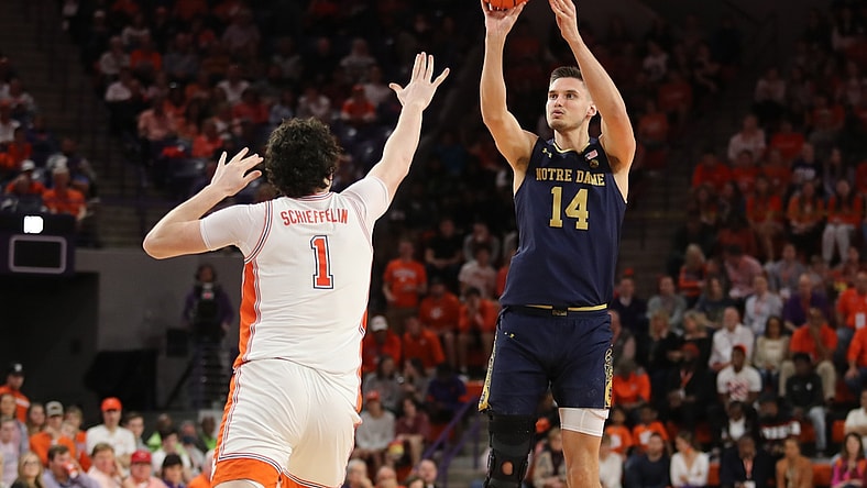 Feb 12, 2022; Clemson, South Carolina, USA; Notre Dame Fighting Irish forward Nate Laszewski (14) shoots the ball against Clemson Tigers forward Ian Schieffelin (1) during the first half at Littlejohn Coliseum. Mandatory Credit: Dawson Powers-USA TODAY Sports