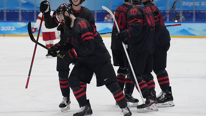 Feb 15, 2022; Beijing, China; Team Canada forward Eric O'Dell (19) celebrates his goal against China during the second period in a men's ice hockey qualification match for the quarterfinals during the Beijing 2022 Olympic Winter Games at National Indoor Stadium. Mandatory Credit: George Walker IV-USA TODAY Sports