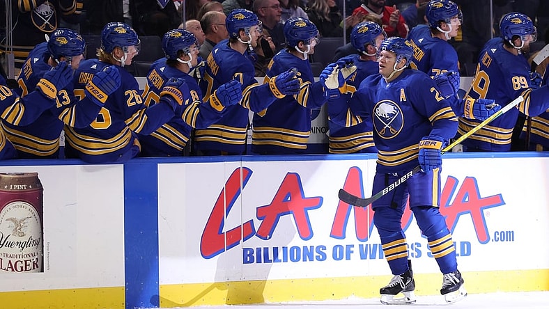 Feb 15, 2022; Buffalo, New York, USA;  Buffalo Sabres right wing Kyle Okposo (21) celebrates his goal with teammates during the first period against the New York Islanders at KeyBank Center. Mandatory Credit: Timothy T. Ludwig-USA TODAY Sports
