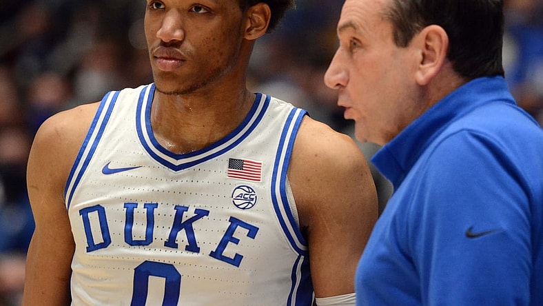 Feb 15, 2022; Durham, North Carolina, USA; Duke Blue Devils head coach Mike Krzyzewski (right) give instructions to  forward Wendell Moore Jr. (0) during the first half against the Wake Forest Demon Deacons at Cameron Indoor Stadium. Mandatory Credit: Rob Kinnan-USA TODAY Sports