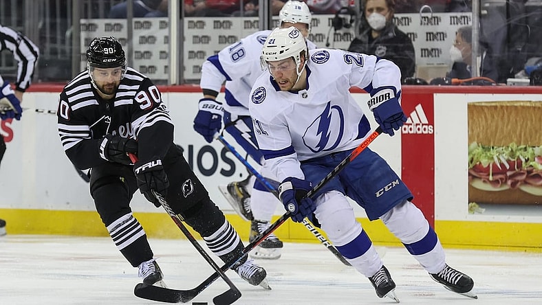 Feb 15, 2022; Newark, New Jersey, USA; Tampa Bay Lightning center Brayden Point (21) skates with the puck against the New Jersey Devils during the first period at Prudential Center. Mandatory Credit: Ed Mulholland-USA TODAY Sports