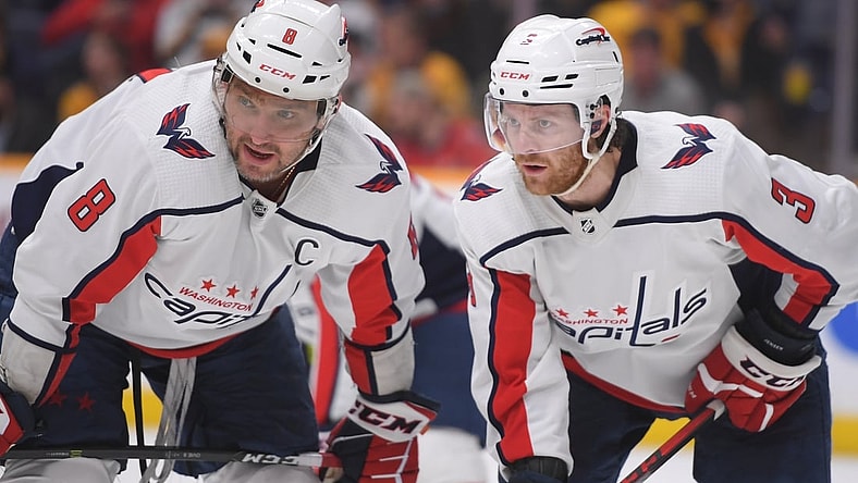 Feb 15, 2022; Nashville, Tennessee, USA;  Washington Capitals left wing Alex Ovechkin (8) and defenseman Nick Jensen (3) discuss the face off against the Nashville Predators during the third period at Bridgestone Arena. Mandatory Credit: Steve Roberts-USA TODAY Sports