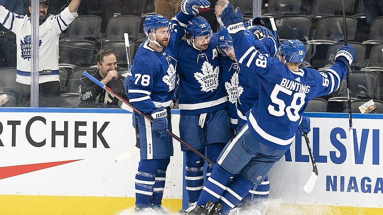 Feb 17, 2022; Toronto, Ontario, CAN; Toronto  Maple Leafs center Auston Matthews (34) celebrates scoring a goal with Toronto Maple Leafs left wing Michael Bunting (58) during the first period against the Pittsburgh Penguins at Scotiabank Arena. Mandatory Credit: Nick Turchiaro-USA TODAY Sports