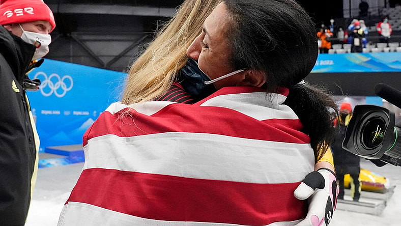 Feb 19, 2022; Yanqing, China; Laura Nolte (GER) hugs Elana Meyers Taylor (USA) after the 2-woman bobsleigh during the Beijing 2022 Olympic Winter Games at Yanqing Sliding Centre. Mandatory Credit: Harrison Hill-USA TODAY Sports