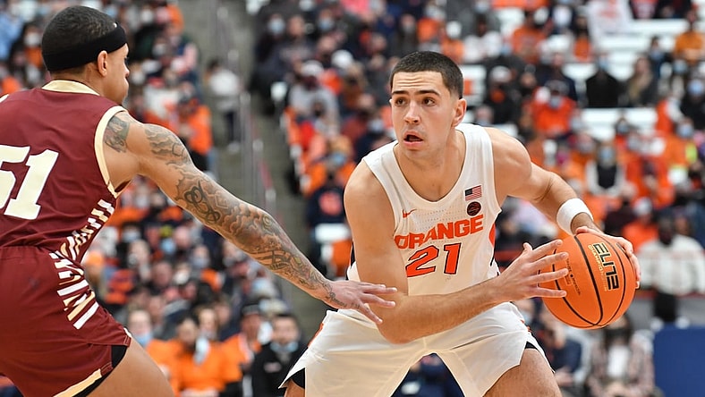 Feb 19, 2022; Syracuse, New York, USA; Syracuse Orange forward Cole Swider (21) faces off against Boston College Eagles guard Brevin Galloway (51) in the second half at the Carrier Dome. Mandatory Credit: Mark Konezny-USA TODAY Sports