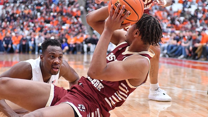 Feb 19, 2022; Syracuse, New York, USA; Syracuse Orange center Bourama Sidibe (left) reacts to Boston College Eagles forward Gianni Thompson (24) gaining control of a loose ball in the second half at the Carrier Dome. Mandatory Credit: Mark Konezny-USA TODAY Sports