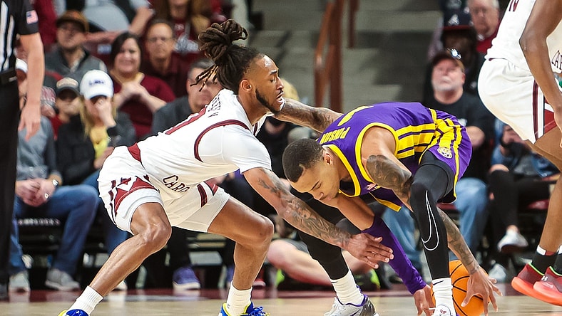 Feb 19, 2022; Columbia, South Carolina, USA; South Carolina Gamecocks guard James Reese V (0) and LSU Tigers guard Xavier Pinson (1) battle for a loose ball in the first half at Colonial Life Arena. Mandatory Credit: Jeff Blake-USA TODAY Sports
