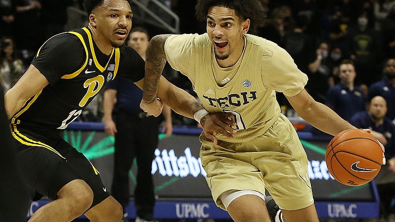 Feb 19, 2022; Pittsburgh, Pennsylvania, USA;  Georgia Tech Yellow Jackets guard Michael Devoe (0) dribbles the ball against Pittsburgh Panthers guard Ithiel Horton (12) during the first half at the Petersen Events Center. Mandatory Credit: Charles LeClaire-USA TODAY Sports
