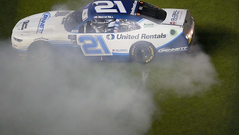 Feb 19, 2022; Daytona, FL, USA; Xfinity Series driver Austin Hill (21) celebrates winning the Xfinity Beef It's What's For Dinner 300 at Daytona International Speedway. Mandatory Credit: John David Mercer-USA TODAY Sports