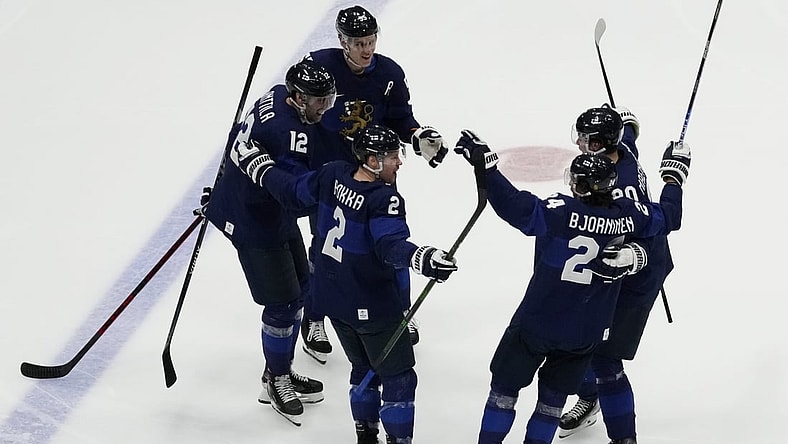 Feb 20, 2022; Beijing, China; Team Finland forward Hannes Bjorninen (24) celebrates with teammates after scoring a goal against Team ROC in the third period during the Beijing 2022 Olympic Winter Games at National Indoor Stadium. Mandatory Credit: George Walker IV-USA TODAY Sports