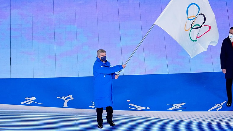 Feb 20, 2022; Beijing, CHINA; IOC president Thomas Bach waves the Olympic flag during the closing ceremony for the Beijing 2022 Olympic Winter Games at Beijing National Stadium. Mandatory Credit: George Walker IV-USA TODAY Sports