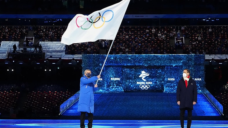 Feb 20, 2022; Beijing, CHINA; IOC president Thomas Bach waves the Olympic flag during the closing ceremony for the Beijing 2022 Olympic Winter Games at Beijing National Stadium. Mandatory Credit: Rob Schumacher-USA TODAY Sports