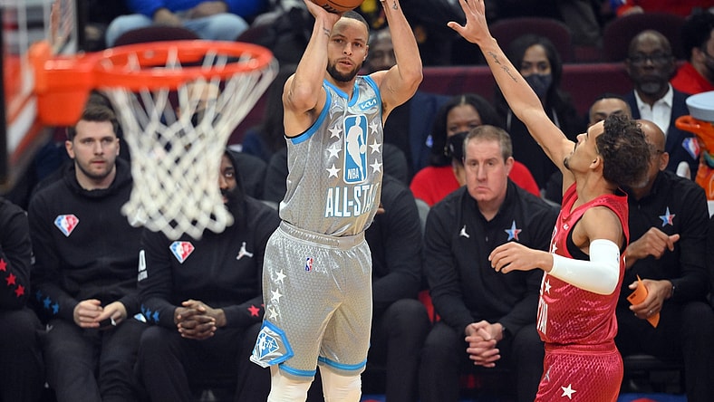 Feb 20, 2022; Cleveland, Ohio, USA; Team LeBron guard Stephen Curry (30) shoots a three point basket against Team Durant guard Trae Young (11) in the first quarter during the 2022 NBA All-Star Game at Rocket Mortgage FieldHouse. Mandatory Credit: David Richard-USA TODAY Sports